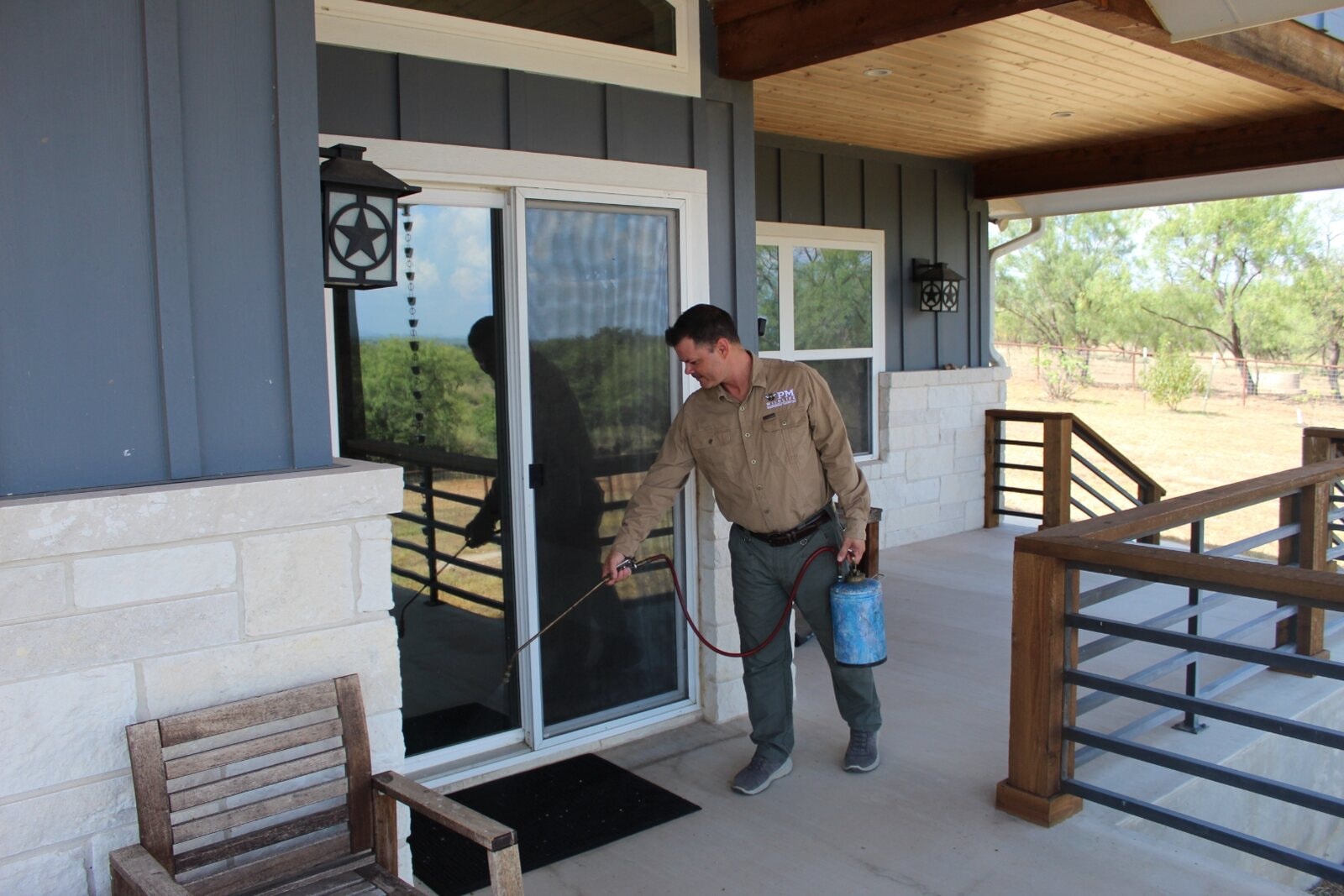 Pest control technician spraying treatment